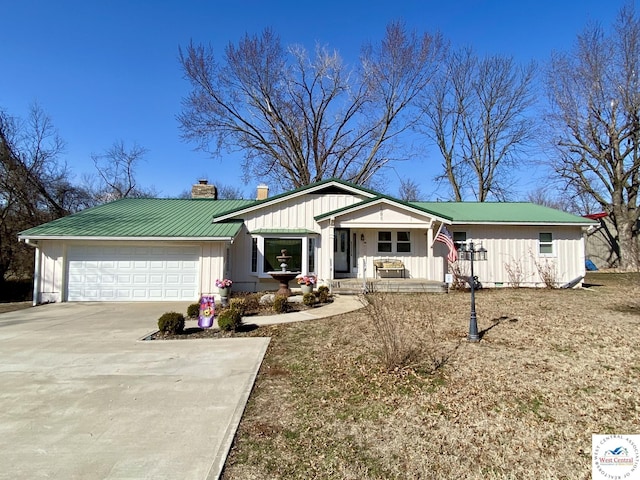 ranch-style home featuring a garage, driveway, metal roof, a porch, and board and batten siding