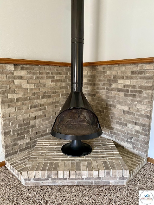 interior details featuring a wood stove