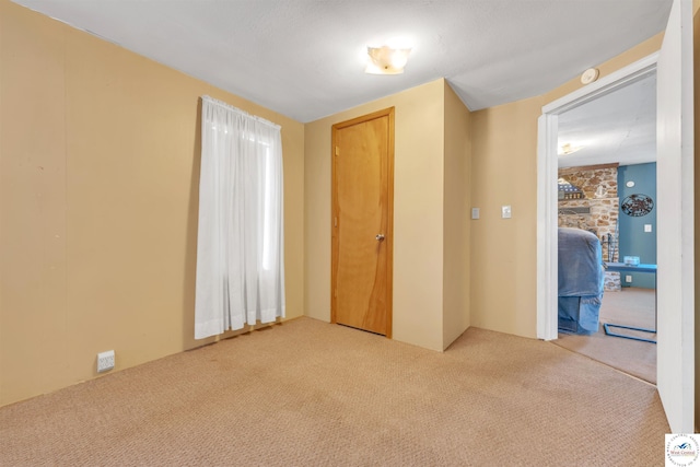 unfurnished bedroom with carpet