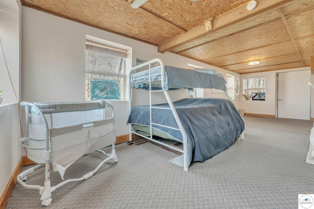 bedroom featuring carpet floors and baseboards