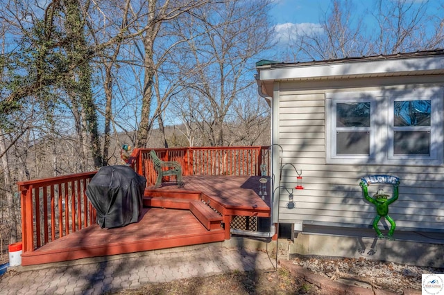 wooden deck with grilling area