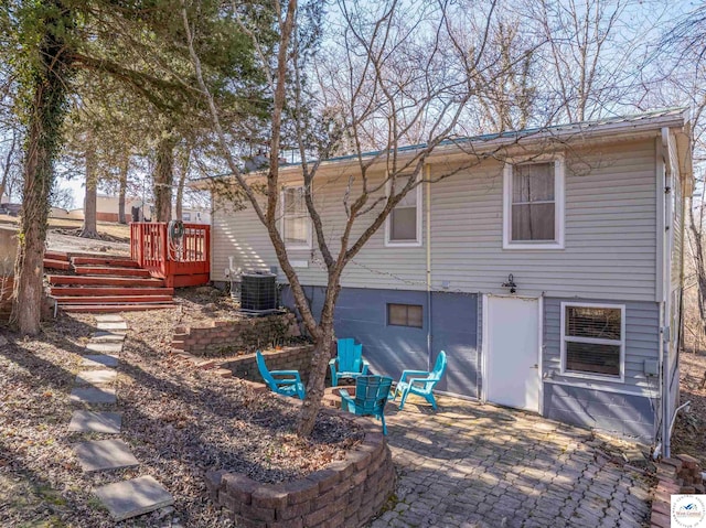 back of property featuring a patio area and cooling unit