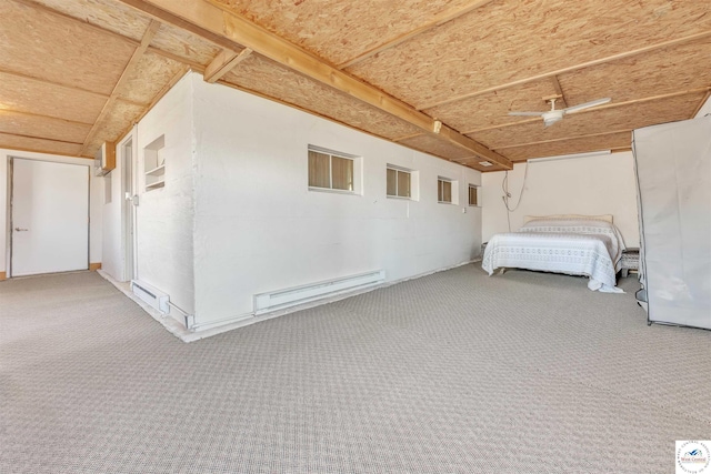 unfurnished bedroom with a garage, carpet, and a baseboard radiator