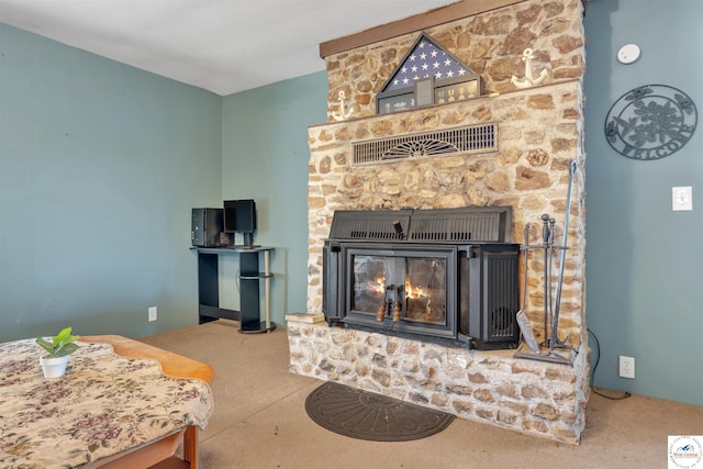 interior space featuring carpet floors, visible vents, and a stone fireplace