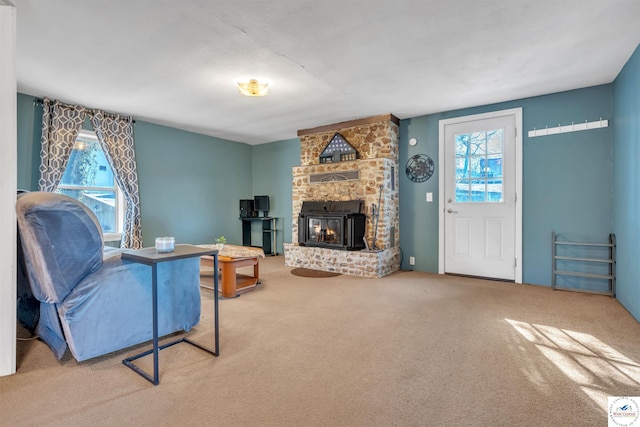 living room featuring carpet and a fireplace