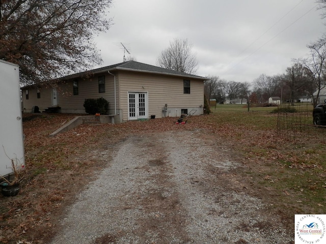 view of side of home with french doors