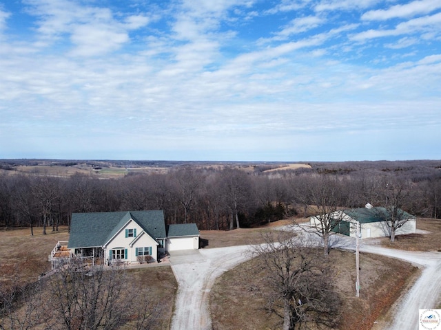 bird's eye view featuring a forest view