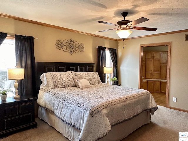 bedroom with ornamental molding, light colored carpet, multiple windows, and a textured ceiling