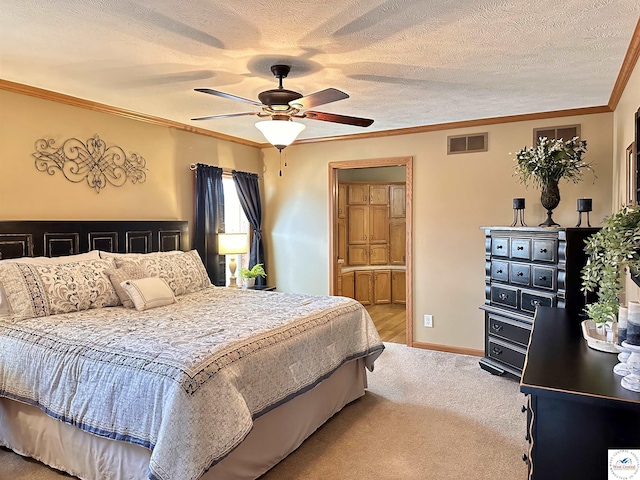 bedroom with carpet floors, crown molding, visible vents, a textured ceiling, and baseboards