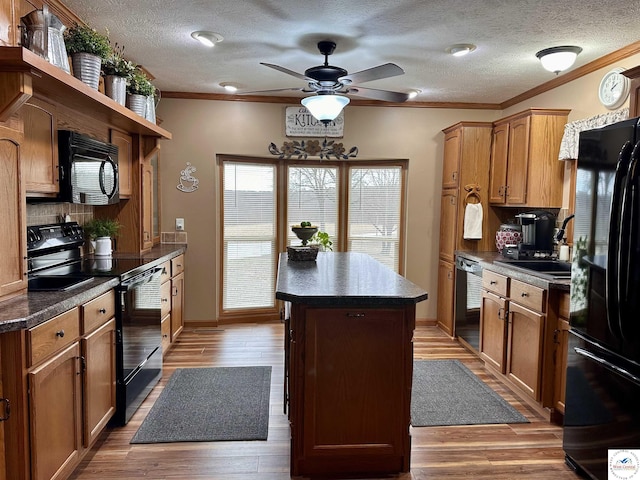 kitchen featuring open shelves, a kitchen island, decorative backsplash, black appliances, and dark countertops