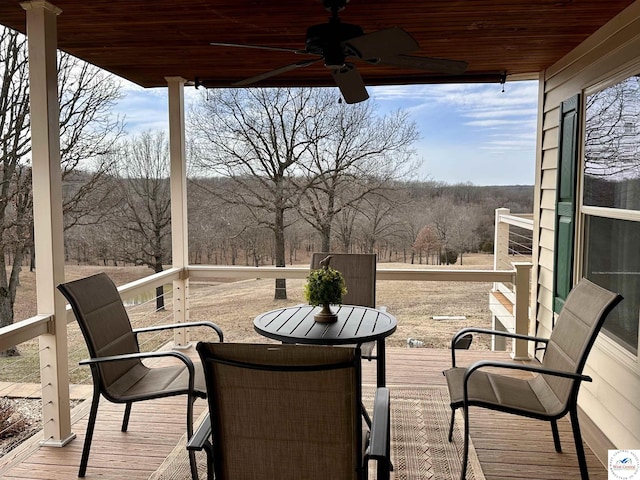 wooden deck featuring a ceiling fan