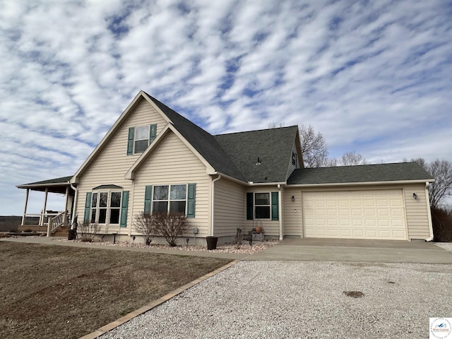 view of front facade featuring a garage, aphalt driveway, and roof with shingles