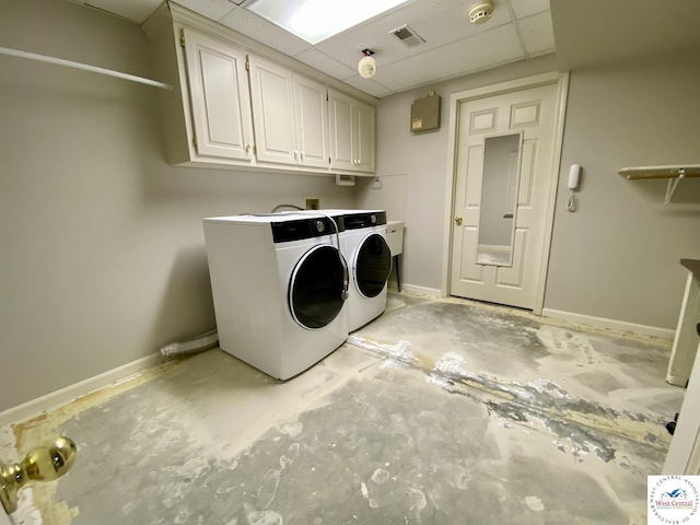 laundry room with baseboards, cabinet space, visible vents, and washing machine and clothes dryer