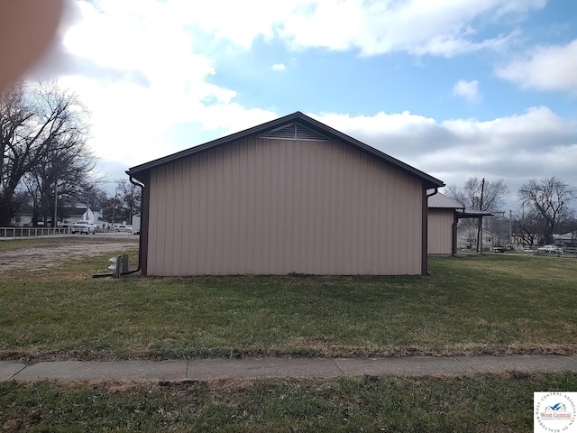 view of property exterior featuring a lawn