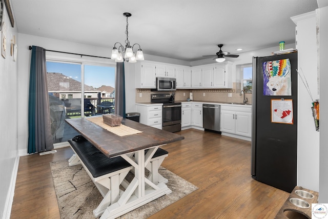 kitchen featuring decorative backsplash, a healthy amount of sunlight, appliances with stainless steel finishes, and a sink