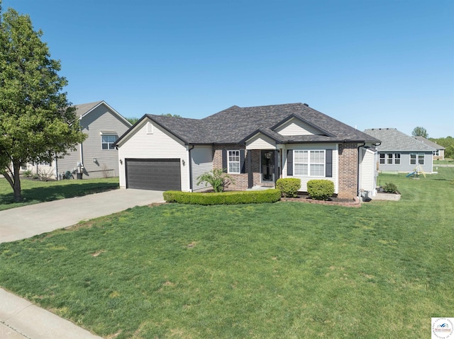 single story home with brick siding, a garage, driveway, and a front lawn