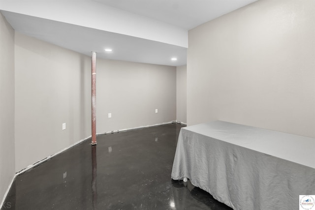 unfurnished bedroom with concrete floors