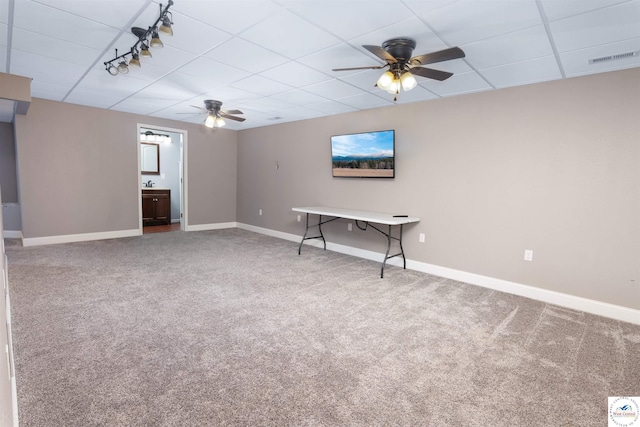 interior space featuring visible vents, baseboards, ceiling fan, and carpet floors