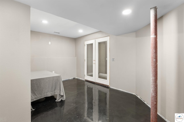 interior space featuring recessed lighting, finished concrete flooring, and french doors