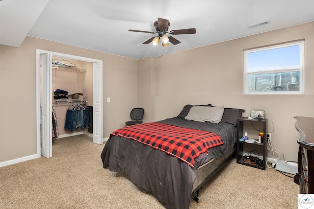 bedroom with carpet, visible vents, a closet, and baseboards