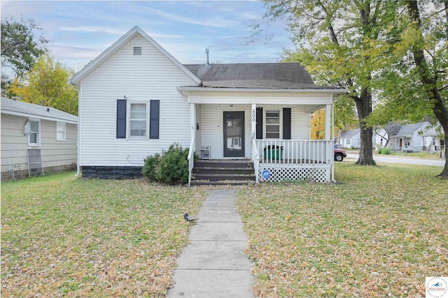 bungalow featuring a porch and a front yard