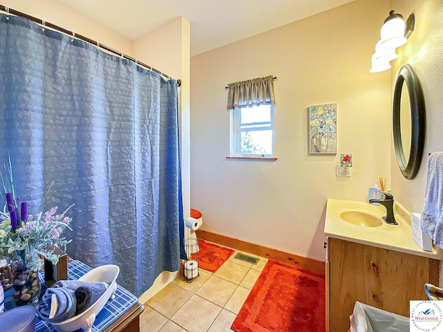 full bathroom featuring baseboards, vanity, visible vents, and tile patterned floors