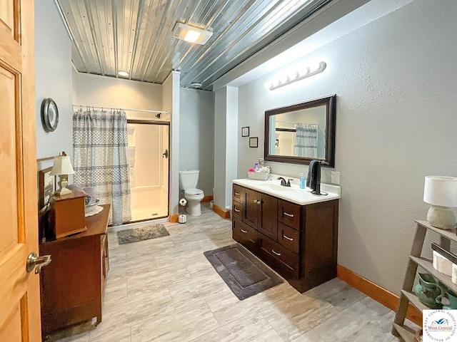 bathroom featuring baseboards, toilet, wooden ceiling, vanity, and a shower stall