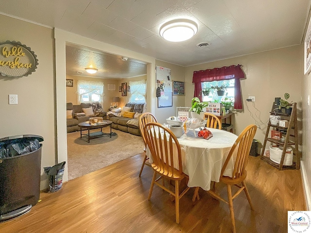 dining room featuring visible vents and light wood-style floors