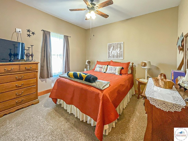 bedroom with baseboards, ceiling fan, and light colored carpet