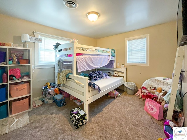 carpeted bedroom with visible vents