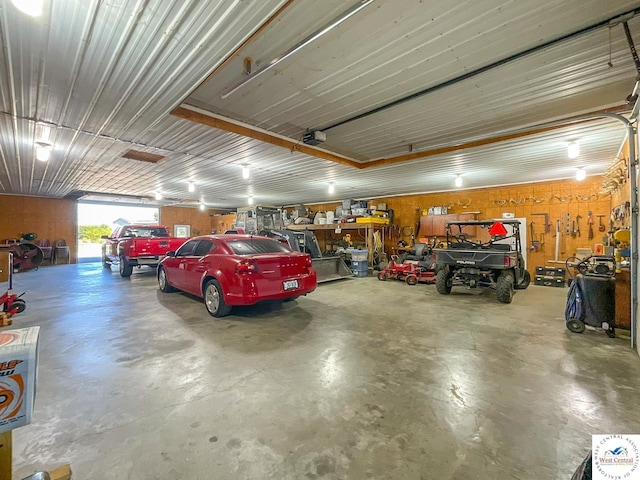 garage featuring a workshop area and a garage door opener