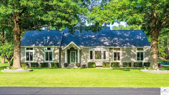 new england style home with a front yard