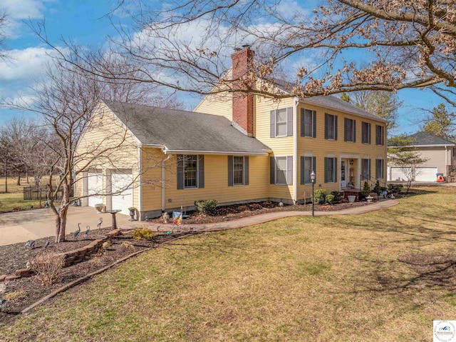 view of front facade with a front lawn, roof with shingles, and a chimney