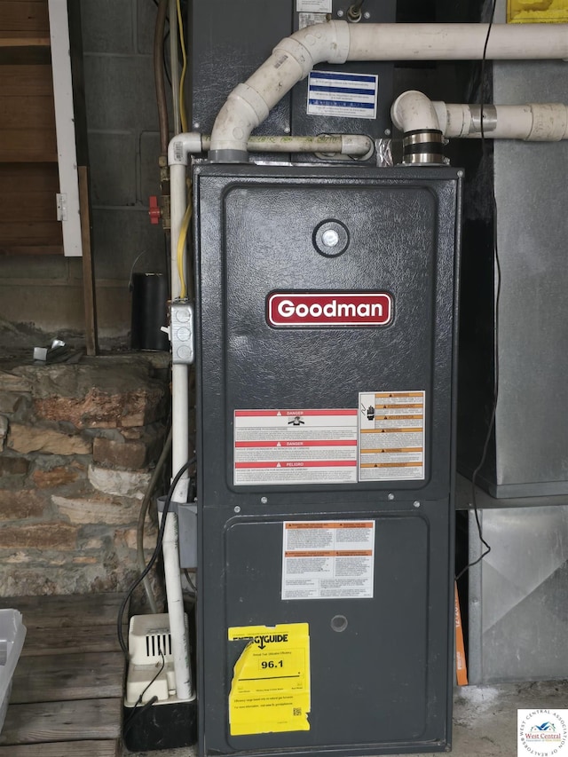 utility room featuring heating unit