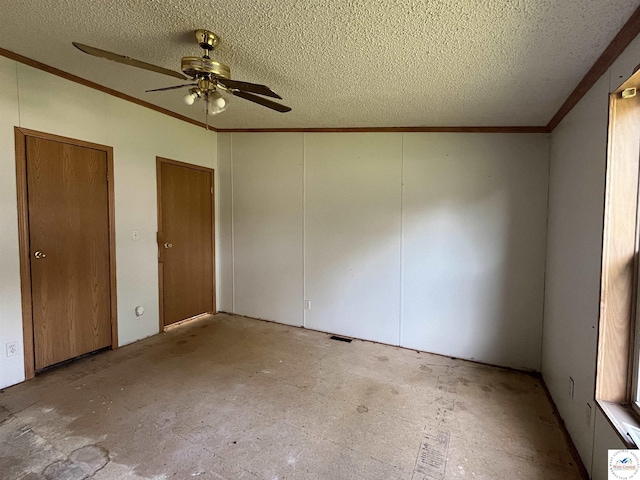 unfurnished bedroom with a textured ceiling, ceiling fan, visible vents, and crown molding