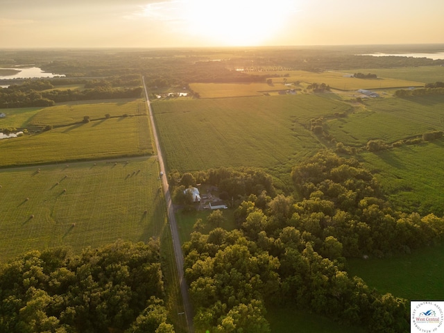 aerial view at dusk featuring a rural view