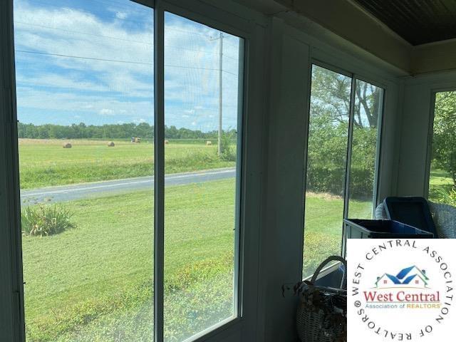 doorway to outside featuring a rural view