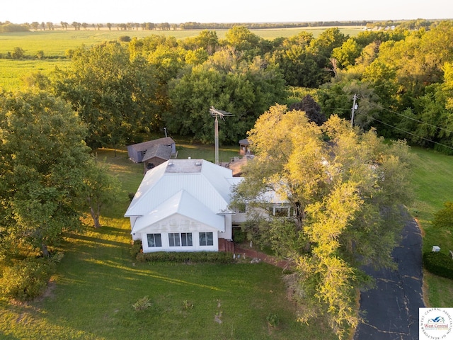 birds eye view of property with a rural view