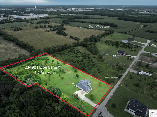 birds eye view of property featuring a rural view