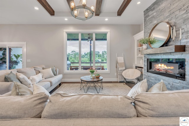 living room with recessed lighting, wood finished floors, beam ceiling, and a stone fireplace