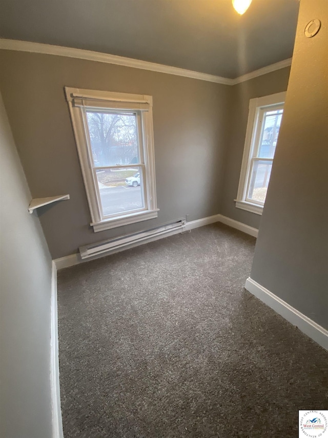 spare room featuring ornamental molding, carpet flooring, baseboards, and baseboard heating