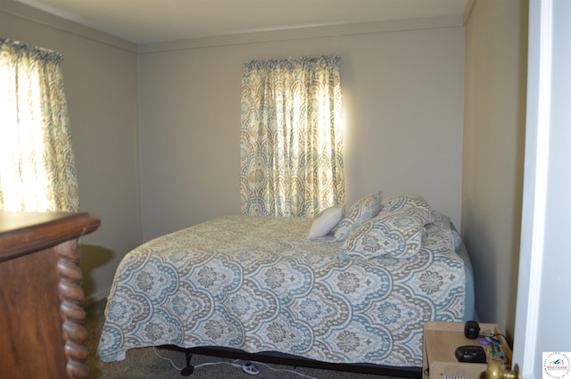 bedroom with ornamental molding