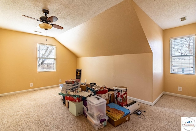 game room featuring visible vents, plenty of natural light, and carpet flooring