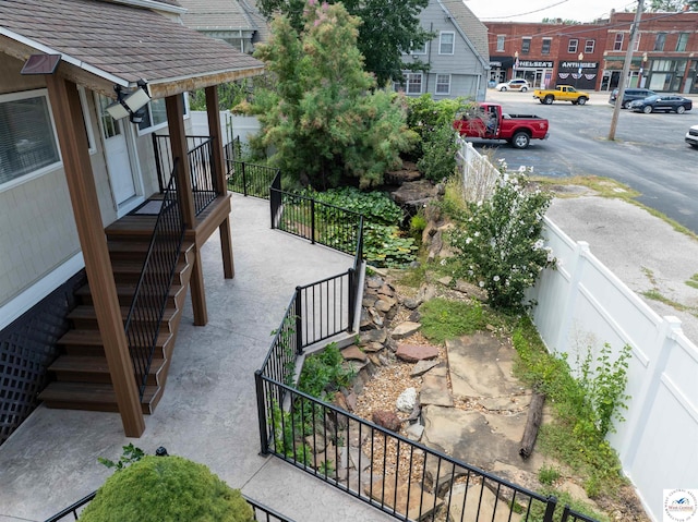 view of patio featuring fence