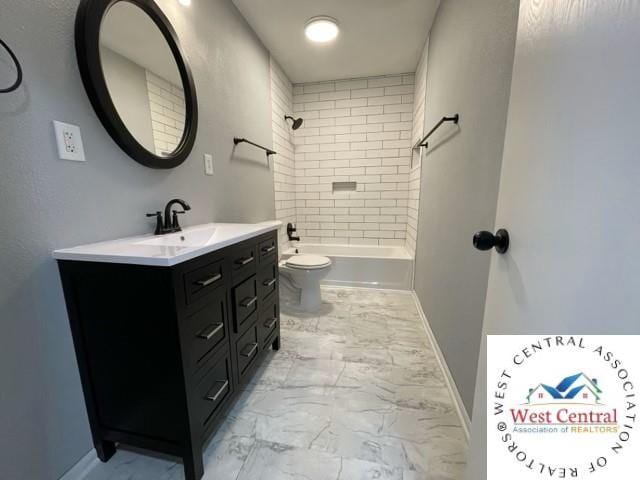 bathroom with toilet, marble finish floor, baseboards, and vanity