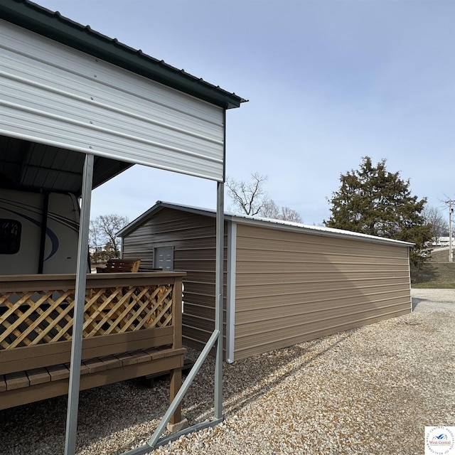 view of side of home featuring metal roof