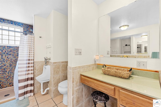 bathroom featuring toilet, tile walls, a shower stall, and tile patterned floors