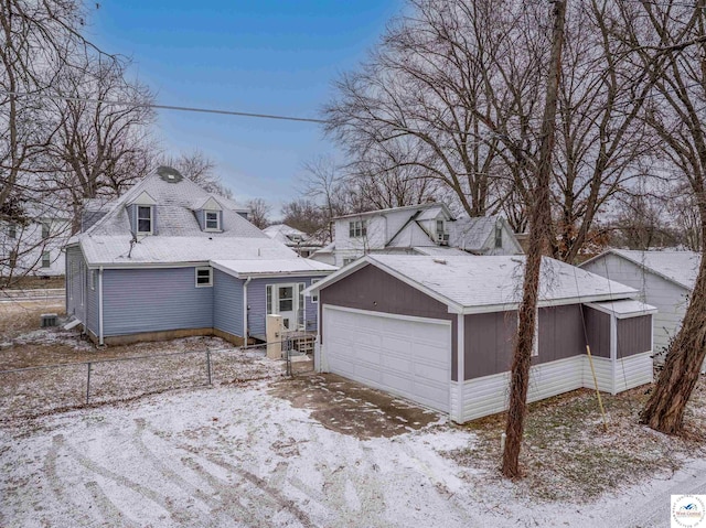 view of front of home with fence and a sunroom