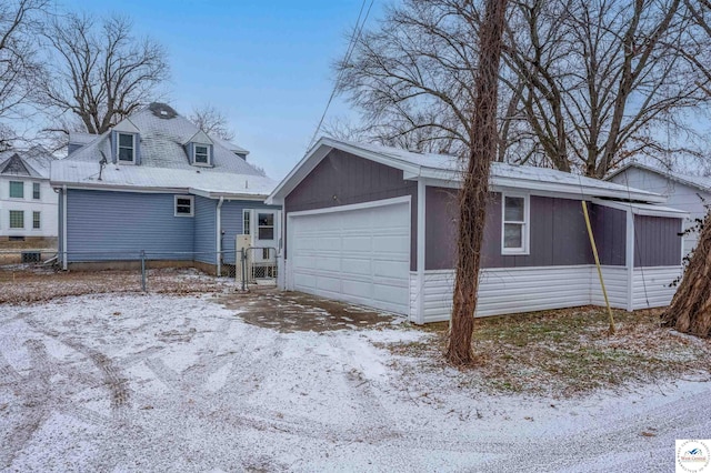 exterior space with a detached garage