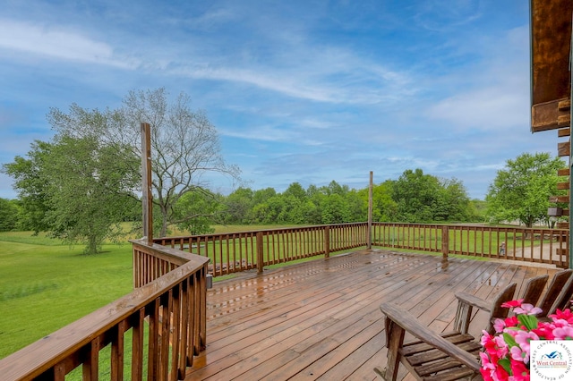 wooden terrace featuring a lawn